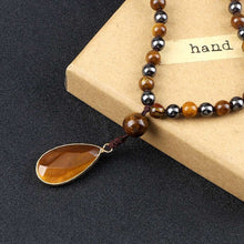 Afbeelding in Gallery-weergave laden, handmadebynepal Tiger Eye Stone Hematite Necklace Health Protection 108 Mala Bead Handmade Knotted Yoga Jewelry Men Women Drop Pendant Necklaces  Handmadebynepal   